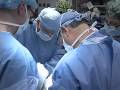 Surgery: A multi-disciplinary team of doctors and surgeons perform the first near-total face transplant in the USA