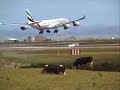 Emirates landing at Auckland Airport New Zealand Emirates landing at Auckland Airport New Zealand
