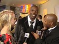ro parrish talks to terrell owens about his atire for the night at his birthday party