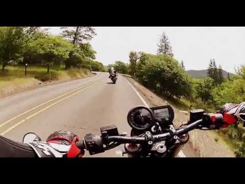 brammo - 2013 Brammo Empulse R electric motorcycle chases a 2007 Suzuki GSXR 750 up a twisty mountain road somewhere in Oregon.