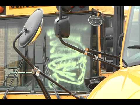 school vandalized - Two people vandalized 20 school buses parked in a lot next to Loris High School and a classroom at Loris High School early Thursday morning.