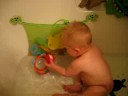 Austin Throwing a ball while taking a bath