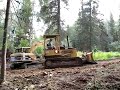 Mike Benson Grades teh new Driveway with the Dozer while the Excavator Digs a Hole for Burying Trees