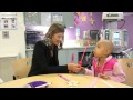 Stana Katic of ABC's Castle Blows Bubbles with Little Girl at Children's Hospital Los Angeles