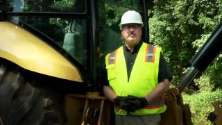 Learn the location of your Cat® backhoe loader's grease points.