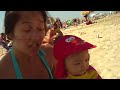 baby buried in sand