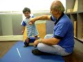 Physiotherapy.Cerebral palsy.Yusuf taking weight on his legs Physiotherapy.Cerebral palsy.Yusuf taking weight on his legs