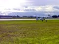 Towplane taking off with glider in tow.