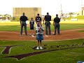 Skyler sings the National Anthem at a KC T-Bones game.