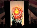Artist Vimal G. Gabrielsen paints Live as a silhouette behind Canvas during a concert of Praful & friends at Osho Leela, UK, on 23 August 2008. Featuring Praful on Bansuri (Indian Bamboo Flutes) and Vocals, Magda Mendes on vocals and Roel Calister on percussion. The song played Live is 'Where Spirits Live