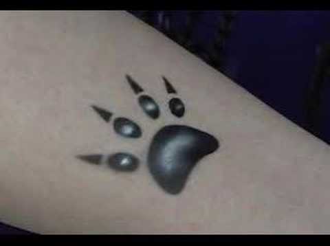 airbrushing a ear claw with bear claw tattoos. airbrushing a ear claw with