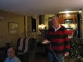 grandpa and dad having a crazy fun boxing match on the wii system. this is fun for any age..this will show.