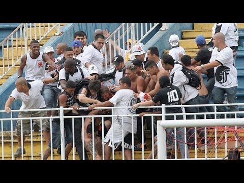 Brazilian police fire rubber bullets as violence flares at football match