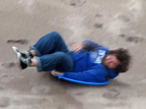 Sled Riding down the Great Sand Dunes National Park in Colorado!