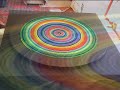 Filmed April 10th 2007, at a Buddhist shrine in Chichester, this video tells the story of a sand painting born only the day before.In Tibetan Buddhist tradition, the Mandala is brought to an end, honouring the Buddhas teaching of 'impermanence' : that all things arise and fade away - that all things are temporary in nature.In the video you will see many members of the local and visiting Tibetan Buddhist commuity contributing to the growth of the mandala, including the special guest Dr Akong Tulku Rinpoche.Many thanks to David Mackenzie-Dewhirst for his kind help and guidance in making the mandala, and should anyone like to enquire further about sand mandalas or other therapeutic artforms he practices, he can be contacted at:www.artmatters.nhs.uk The word Mandala is sanskrit and litterally means 'Circle' & 'Center', it suggests the notion that any centre is tied to it's circumferance, and that any circumferance is always determined by it's center, together they represent a wholeness.The Making Of The Mandala:Traditionally, the sand for madalas is made by crushing precious and semi-precious stones such as coral and turquoise amber etc, but this is no longer done. The sand is dyed using vegetable dyes or opaque tempera or acrylics, it is applied to the mandala disc (base) with a narrow metal funnel called a 'chakpu', which is tapped against to cause sufficient vibration for grains of sand to trickle out of its end. Stray grains of sand are moved back into place with small brushes, no adhesives are used to maintain the position of the sand.Mandala's to Promote Health & Healing:There has been medical research to show that the bodies immune system and innate healing ability are enhanced when we are relaxed, creativity appears to trigger the bodies relaxation response, promoting one's own health and healing and increasing stress reduction.Finally: In the dismantling of the mandala one should remain in the same relaxed and meditative state of mind, as in its creation. Mandala's can help us to understand that all things are impermanent and exist only in relation to, and in independence on other things.The Kagyu tradition is one of the four main schools of Tibetan Buddhism. It is reknowned for its emphasis on meditation as embodied by such great masters as Marpa, Milarepa and Gampopa, whose example inspired people throughout Tibet.The supreme head of the Kagyu lineage is the Karmapa.Kagyu Samye Dzong London is a branch of Kagyu Samye Ling Monastery in Scotland, a Buddhist Centre which was established in 1967 and now has branches worldwide. Kagyu Samye Dzong London is under the direct guidance of Dr. Akong Tulku Rinpoche and Ven.Lama Yeshe Losal, whose lives and activity are an endless source of inspiration for the thousands of people who come into contact with them every year. They are known for their tireless efforts in preserving the purity of the Buddha's teachings, and the Kagyu lineage in particular and they visit Kagyu Samye Dzong London regularly giving teachings, guidance and empowerments. The day to day guidance of the centre is by Lama Zangmo.More information here:http://london.samye.org/london/