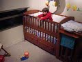 at 1 yr & 7 months ethan goes 3 for 3 in hitting a target the size of a belt buckle from his baby bed & then celebrates with a happy dance