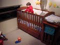 at 1 yr & 7 months ethan goes 3 for 3 in hitting a target the size of a belt buckle from his baby bed & then celebrates with a happy dance