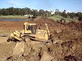 Cat D7H pushes large rocks out of new dam floor PART 2 Cat D7H pushes large rocks out of new dam floor PART 2