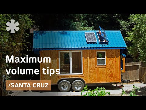 Tiny home packs storage stairs, 2 lofts, tub in 136 sq ft