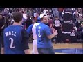 Fan makes a basketball dunk while he's on the phone