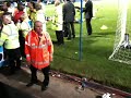 Norwich players celebrating promotion and Paul Lambert mobbed