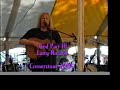 larry norman performing at cornerstone 2000 (c2k). he put on one of his better sets that day.