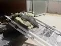 Raw: reporter tries on bomb suit