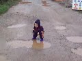 Ben splashing in puddles