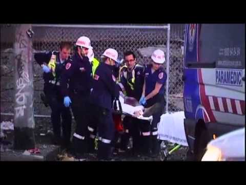 raw - A truck was left dangling over the side of a motorway bridge in Melbourne, Australia, on Friday after it flipped over and threw the driver 65 feet onto anoth...