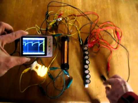 Joule Ringer - This is the first time I have been able to keep a Joule Thief type device running a CFL on just an electrolytic capacitor.