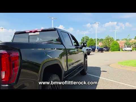 Used 2024 Onyx Black GMC 4WD CREW CAB 147" AT4 image 1
