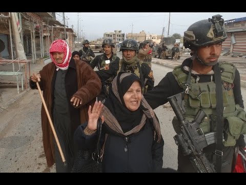 As Iraqi troops secure the center of shattered Ramadi, traumatised families scramble from the rubble, telling of summary executions by IS militants.