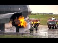 Airport fire fighter training excercise. Manchester Airport UK