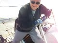 sailing in sfo bay, raymarine autopilot at the helm, one skip in the sternrail seat, the other goes for a walk on deck.