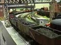 This Hornby 9F 2-10-0 has been succesfully converted into a crosti boilered version. Later in the clip we see a Hornby A4 pacific on a train of Gresley rolling stock. These are the coaches that Hornby produced in Margate between 1981 to 1991 when production was switched to China. Unlike the latest versions of the gresley coaches from China they DON'T fall to bits every time you pick them up, constantly derail and look at the nice close connection between individual coaches. Despite having plastic wheels they run beautifully.