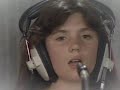 brian in the studio, roger and john playing, but instead of our freddie the singers are a boy and a girl.i think it had a purpose to give money to ill children, or something like that...
anyway, the little singers are fantastic! they are unbelievably talented! just see brian's smile as they reach the 'high point' of the song...i'm sure you're gonna have shiver down your spine! incredible...
well, about the video, i think it was recorded around 1987-88...and the it's quality is great!
(just one more thing for you, queen-fans out there:
 do you think that little girl next to brian is his daughter?...?)