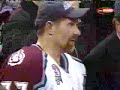 Joe Sakic gives Ray Bourque the Stanley Cup.