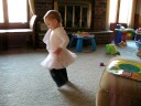 Lucy spins and walks on tiptoes