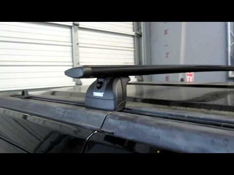 Hummer H3 with Thule Rapid Podium Black AeroBlade Base Roof Rack by Rack Outfitters