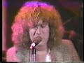 from concert for campuchea, 1979. rockpile joined on stage by robert plant for elvis presley's 