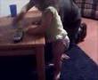 AJ walking along the table