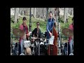 We found this band walking through Central Park on Spring Break. Pretty good. Their CD is very nice; obviously, it's a different version of this song on there, it isn't acoustic and it has a trumpet solo in it as opposed to the guitar solo.