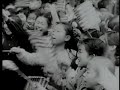 Japanese children sing \"happy birthday\" to MacArthur