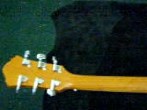 how to fasten a guitar strap