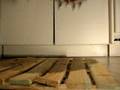 Killer cleats destroy a piece of wooden floor