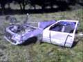 destroying a car with a tractor