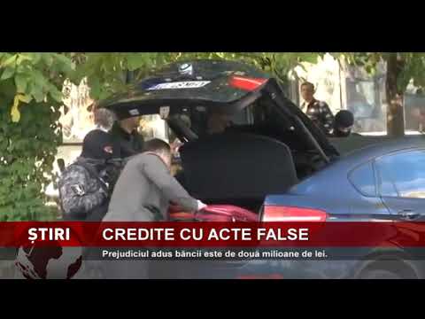 Perchezitii într-un dosar de escrocare a unei bănci