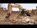 Cat® 390F Excavator Switches Bucket and Ripper Attachments