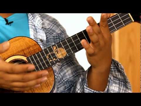 how to hold a ukulele properly