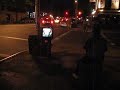 Man watching TV on the street East Village NYC